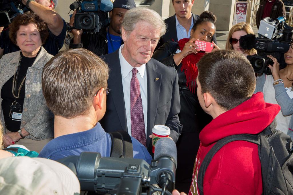 President John Thrasher leads administrators and students to reopen Strozier Library on Nov. 21, 2014, following a campus shooting the previous day.