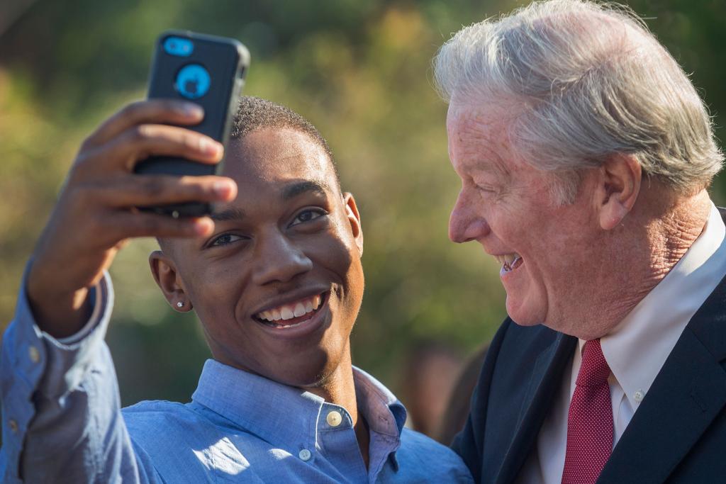 President Thrasher takes a selfie with a student at Westcott Plaza on Oct. 30, 2015.