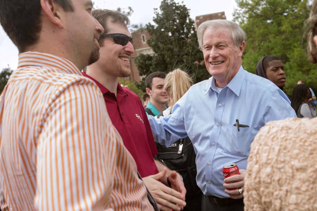 President John Thrasher talks with students at the President's Ice Cream Social in April 2016.