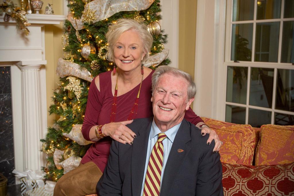 John and Jean Thrasher pose for their annual holiday photo in front of the Christmas tree at the FSU President's house in December 2017.