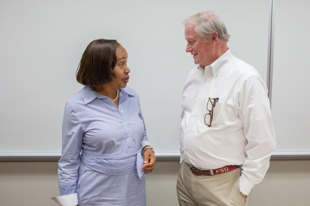 President Thrasher speaks with Professor of English Maxine Montgomery before addressing an English class of CARE students in July 2019.
