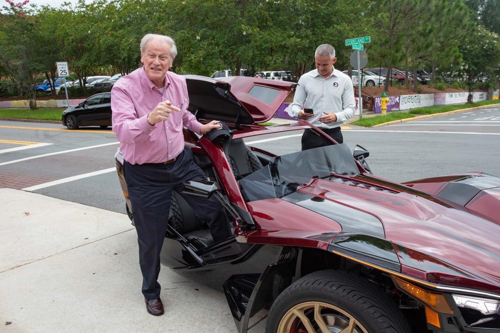 Coach Mike Norvell picks up President John Thrasher for lunch in Polaris Slingshot in June 2021/